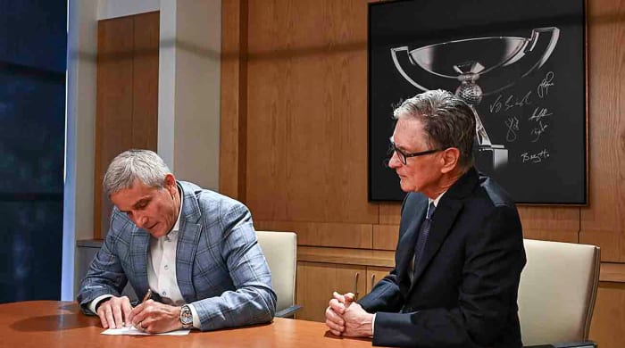 PGA Tour commissioner Jay Monahan and John Henry of Fenway Sports Group sign an agreement announcing the launch of PGA Tour Enterprises in partnership with Strategic Sports Group (SSG) on Jan. 31, 2024, in Ponte Vedra Beach, Fla.